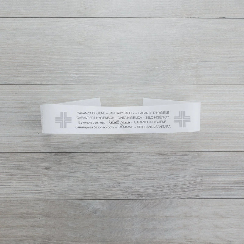 Selo de Garantia Sanitária GFL com informações sobre higiene e segurança em várias línguas, para uso em sanitas, casas de banho e urinóis de hotéis