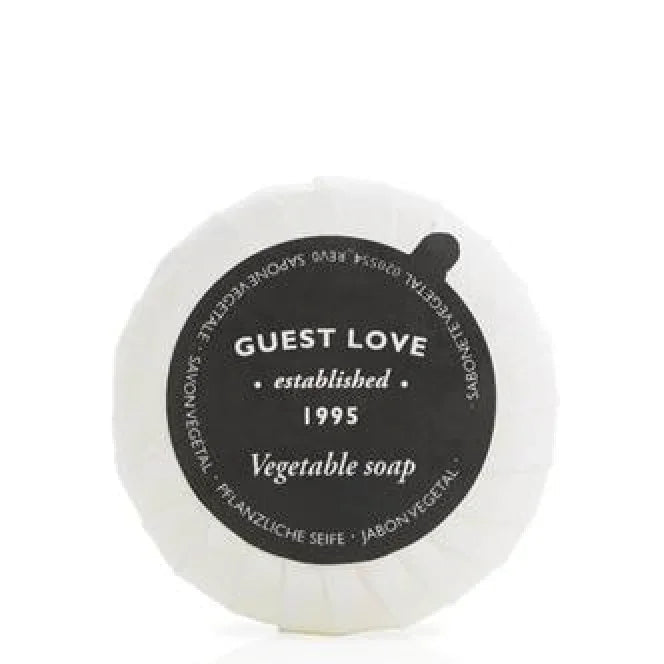 Sabonete Sólido Vegetal Guest Love 20g - sabonete vegetal com embalagem redonda e rótulo preto, formato amenities, perfeito para hotéis e alojamento local