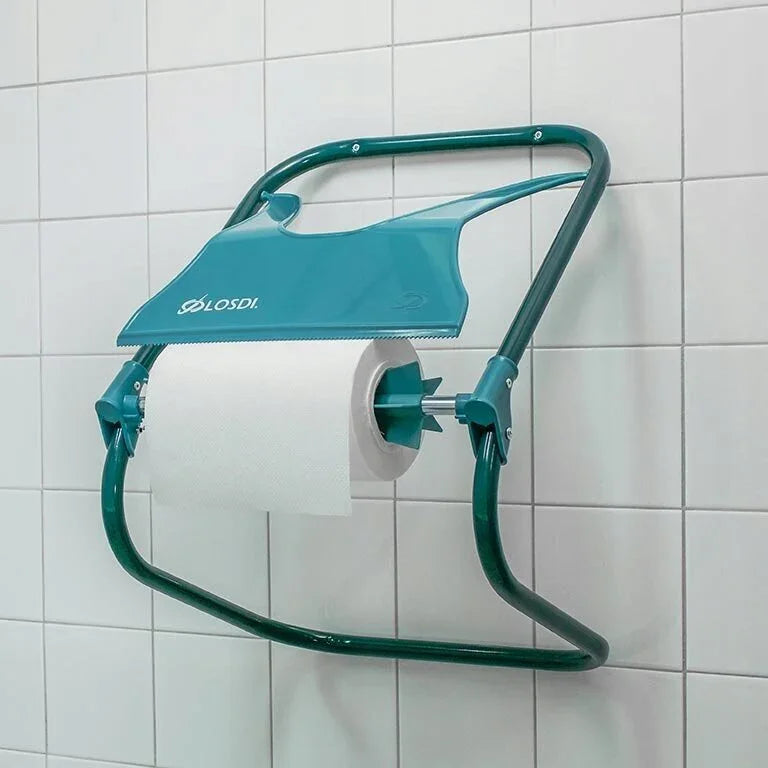 Dispensador de Rolo Papel Industrial Mural Losdi Ocean DPM instalado em parede de azulejos.
