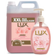 Sabonete das Mãos e Corpo Extra Cremoso 500ml em embalagem XXL de 5L da LUX com flores de primavera.