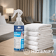 Garrafa de Ambientador e Desodorizante Profissional para Têxteis da marca SANITEC DEO SPRAY em utilização num quarto de hotel moderno