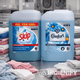 Garrafão de Detergente Líquido Máquina da Roupa Skip Profissional 10L Active Clean usado numa lavadaria em conjunto com o Amaciador Comfort Blue Skies