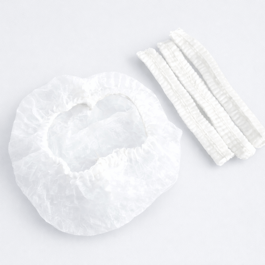 Toucas Clip Brancas Descartáveis com elásticos, pack de 100 unidades, ideal para ambientes limpos e segurança.